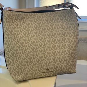 Michael Kors light pink and white handbag.  Used but in great condition!